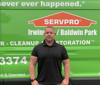 Ben in front of SERVPRO van